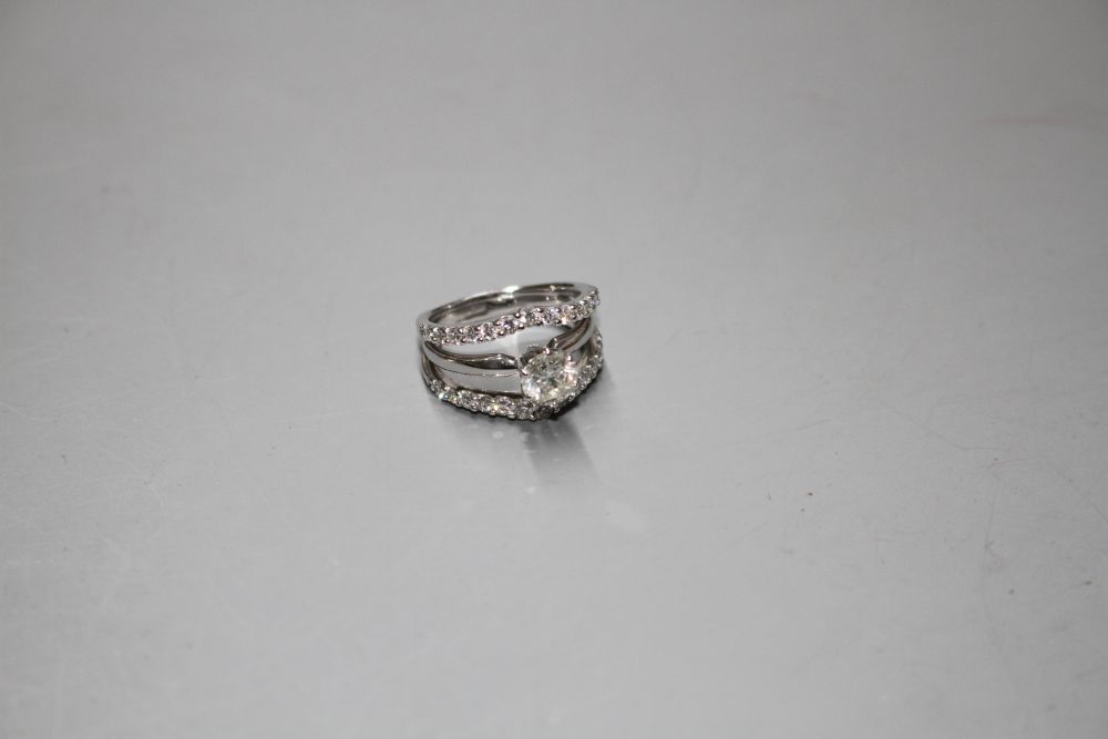 A modern 14kt white metal and triple band diamond dress ring,